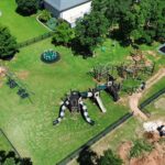 Commercial playground equipment creates park like setting